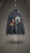 An oversized hoodie featuring a limited edition graphic print is perfectly centered in the frame, shot with a straight-on...